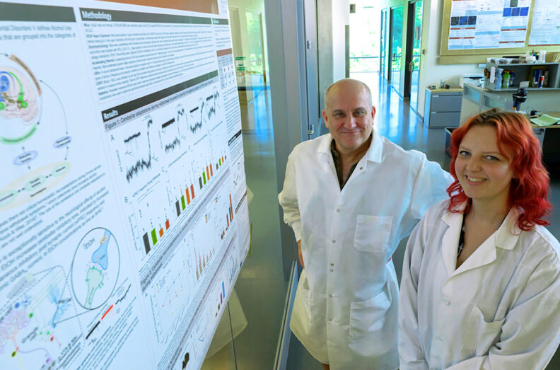 David Rossi, left, an associate professor in the Integrative Physiology and Neuroscience Department in WSU's College of Veterinary Medicine, poses for a photo with Nadia McLean, right, a PhD student in Neuroscience, outside their lab in Pullman.