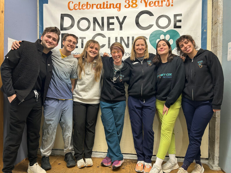Katie Kuehl, center, an associate professor in shelter medicine in Washington State University's College of Veterinary Medicine, poses for a photo with students on WSU’s shelter medicine rotation as they work at the Doney Coe Pet Clinic.