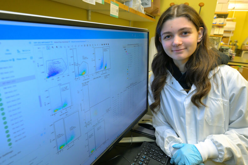 Xenia Tregubov poses for a photo as she works in a lab in the Paul G. Allen School for Global Health.