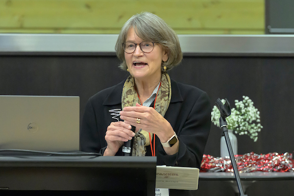 Julia Oxford speaking from the podium.