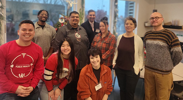 Dr. Allick with a group of eight others.