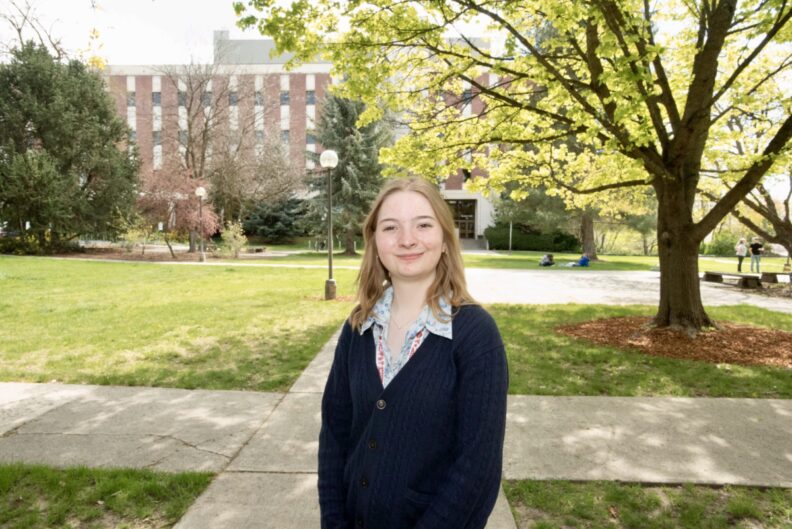 Karenna Meyermann poses in front of Bustad Hall.