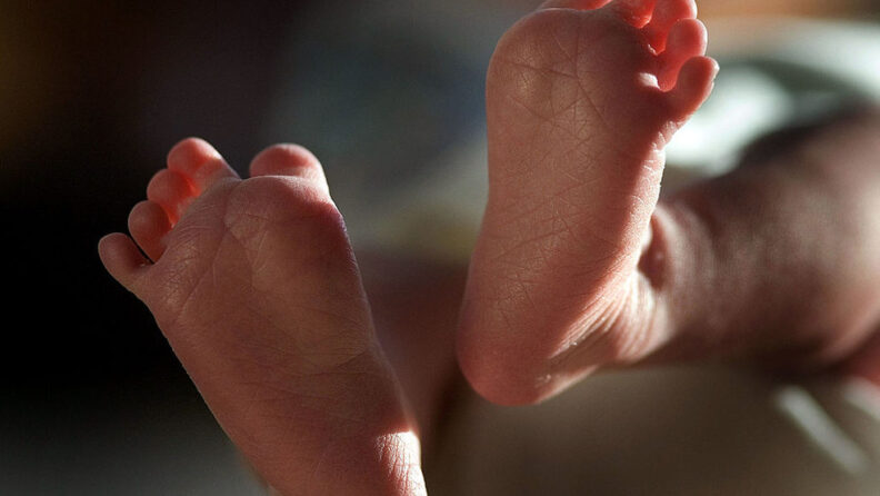 Close up of infant's feet.