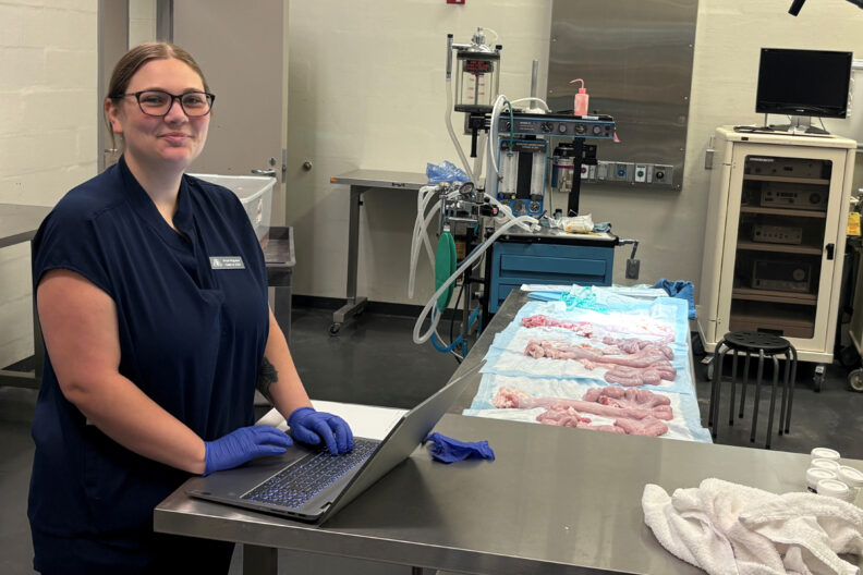 Airyel working at her laaptop in a lab.