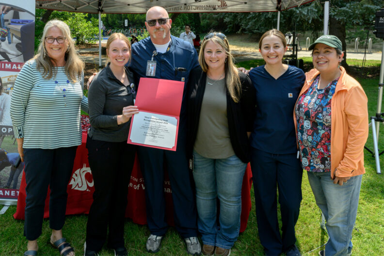 Group posing with dean Dori.
