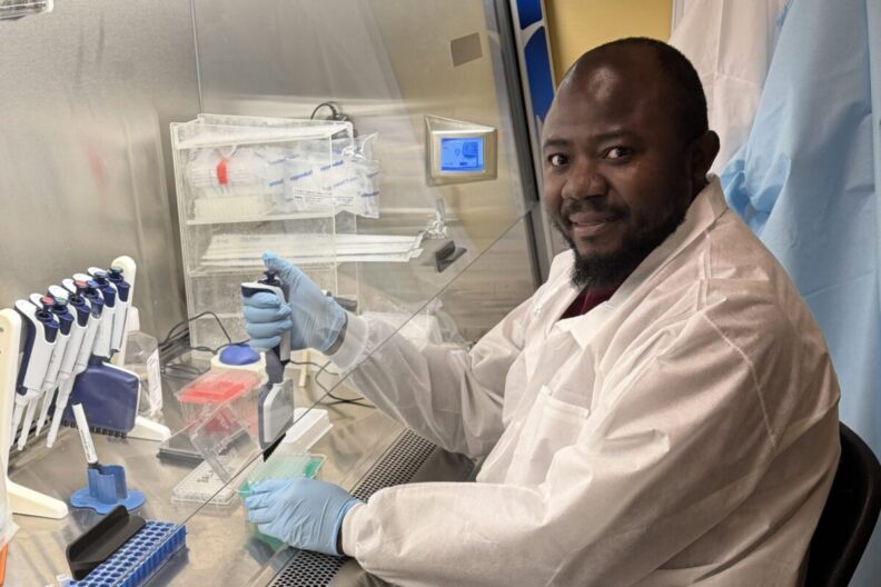 Charchil Ayoda poses in the lab.