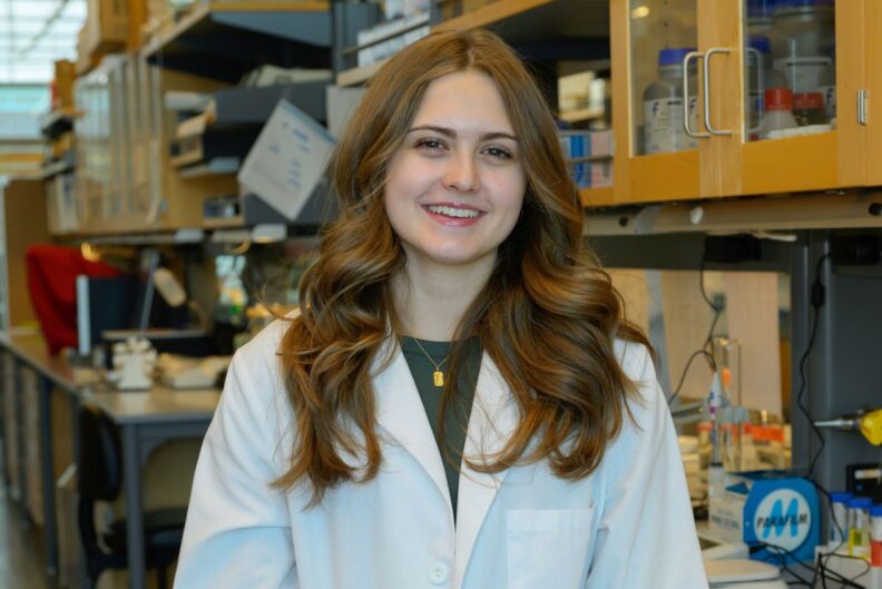 Maya Nash poses in the lab.