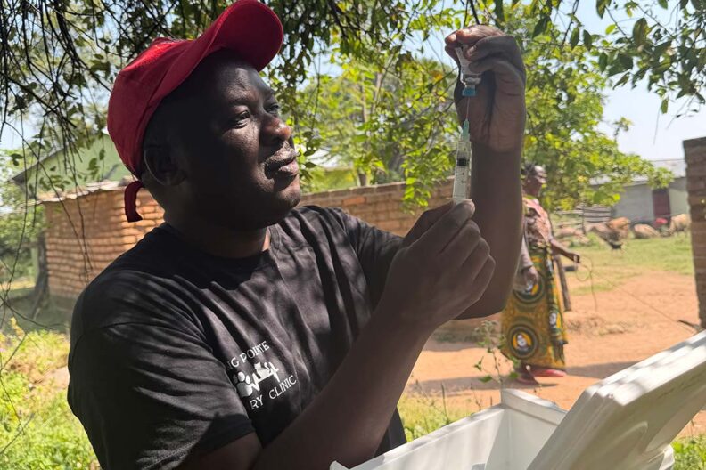 Ahmed Lugelo prepares a rabies vaccine in the rural Tanzanian village of Nyamoko.