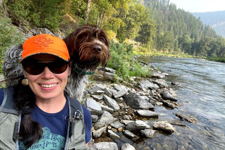 Holly Cummings, a technician in the Diagnostic Imaging service, takes a photo with her dog, Oddly, along the St. Joe River.