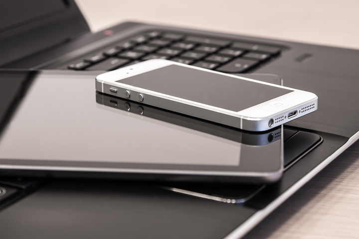 A laptop, tablet and iphone.