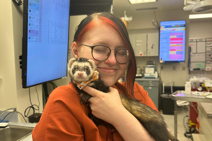 Mikayla holding a ferret.