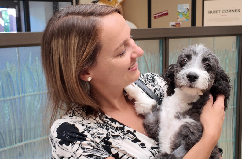 Laura holding the puppy.