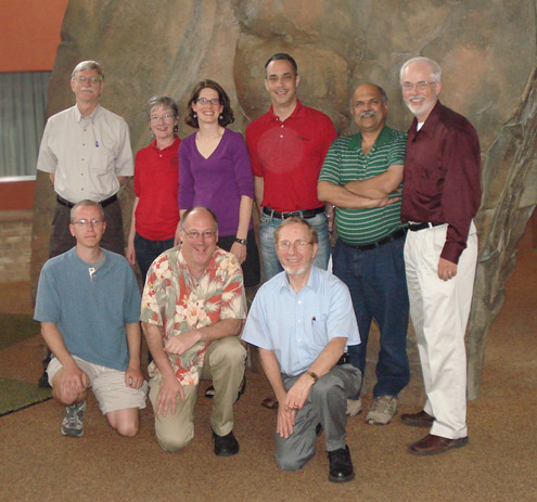 Six people standing and three people kneeling in front of them for a portrait.