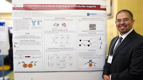 Adan Medina stands next to his project poster.