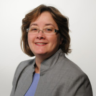 Nancy Ross Sutherland wearing a grey jacket.