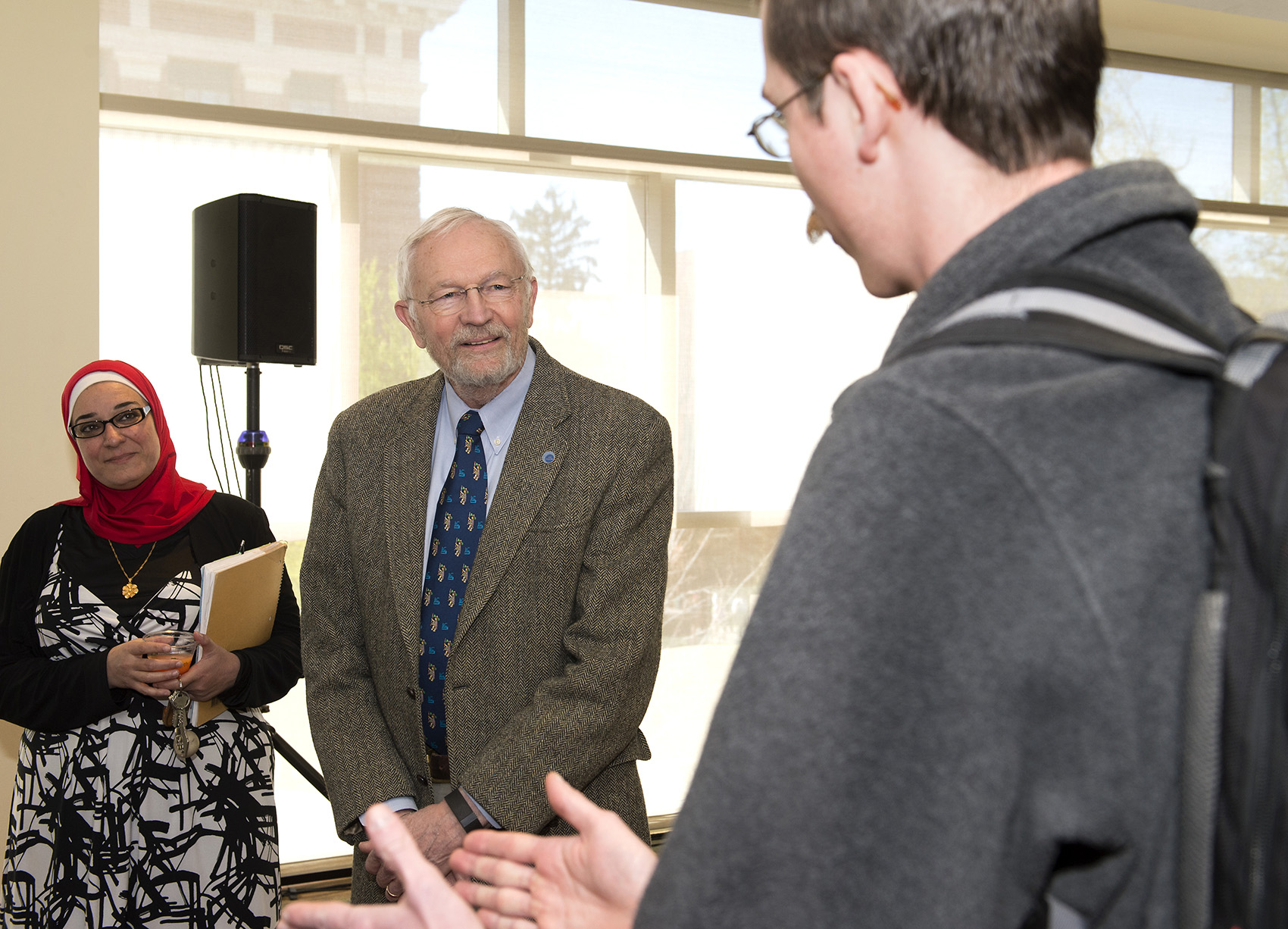 David and Nehal pay attention to a student who is talking to them.