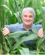 Craig McDonald surrounded by plants.