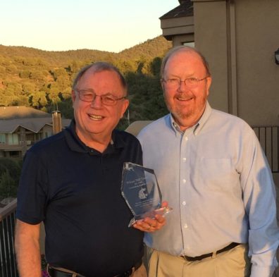 William (Bill) Towne and Jim Petersen posing with an award.