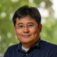 Su Ha wearing glasses.