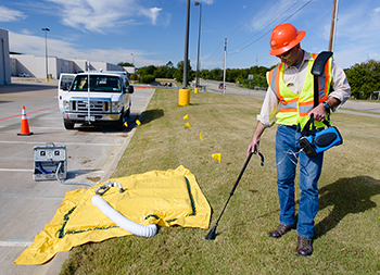 man using methane measuring equipment.