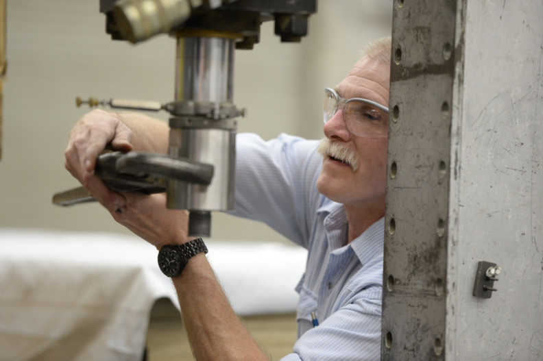 Bob Duncan works on a machine