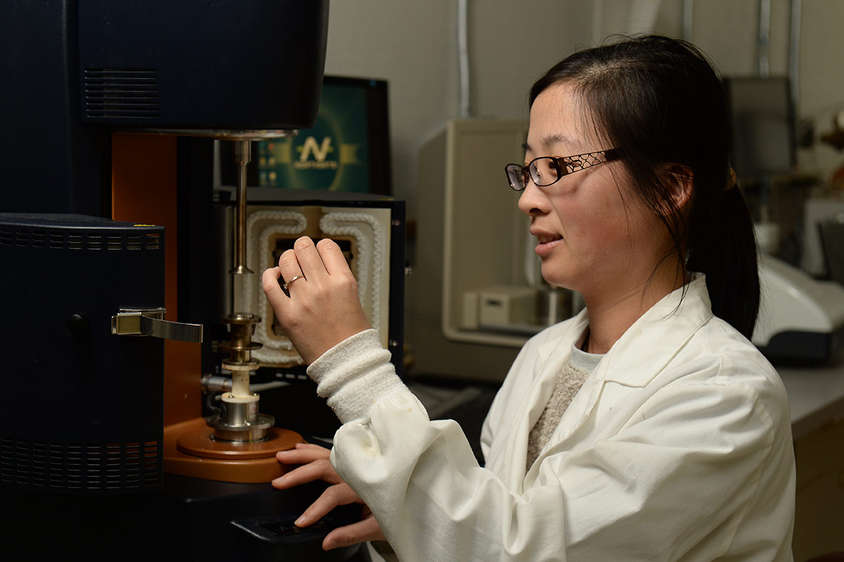 A researcher inspects a sample
