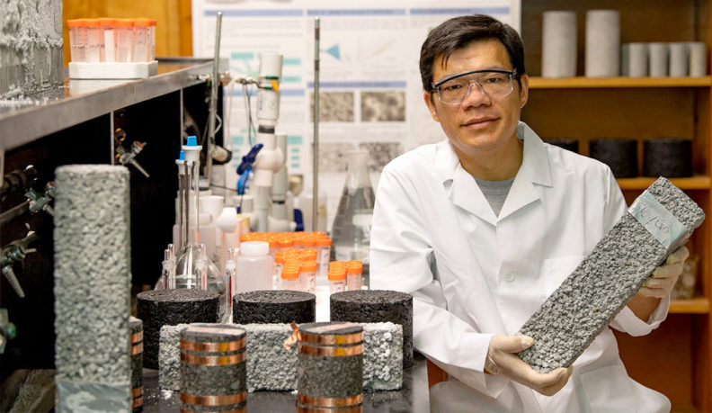 Xianming Shi holding cement samples