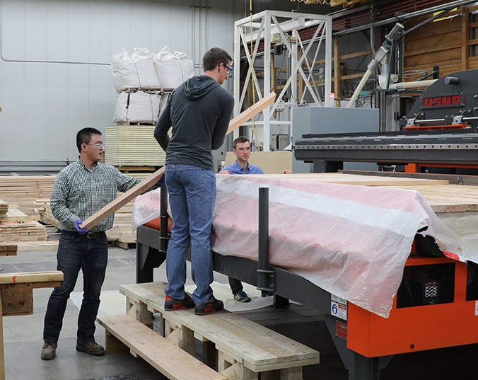 Researchers processing Cross Laminated Timber