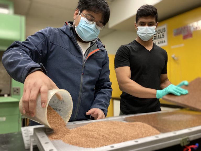 Avishek Chanda and Vyasgowtham Prabhakar prepare hazelnut shells for biobased resin boards