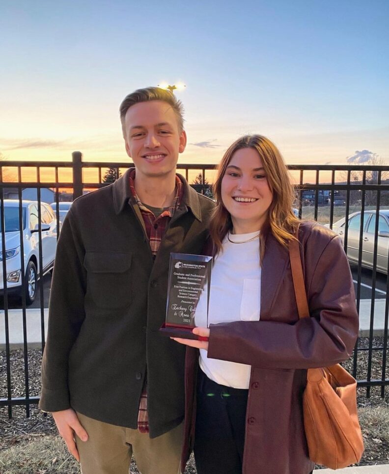 Zach and Anna holding SURCA Graduate Award
