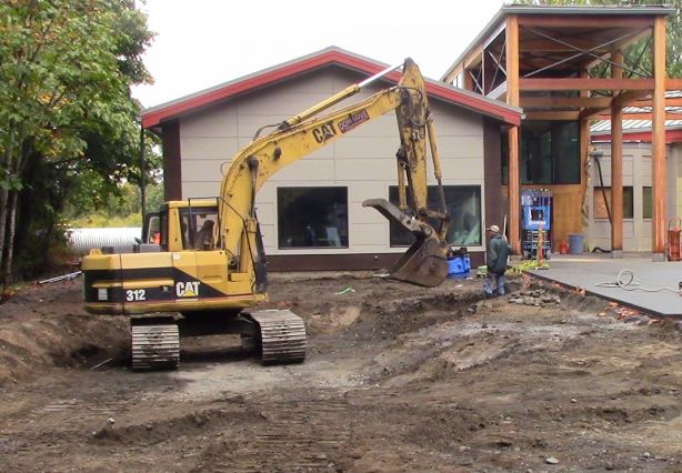 Excavation with a backhoe near the inflow location