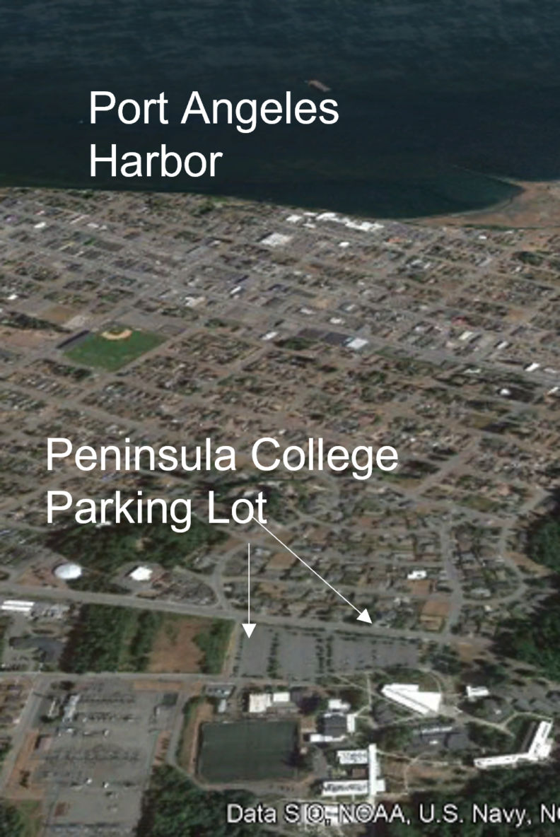 Aerial - oblique of parking lot, city, harbor