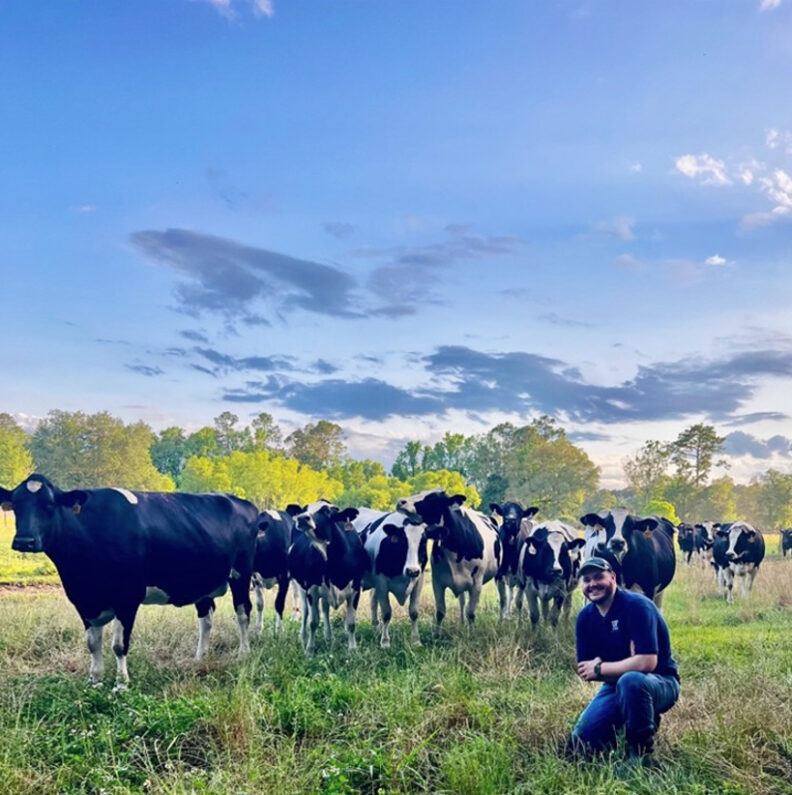 Dr. Zack Seekford with livestock