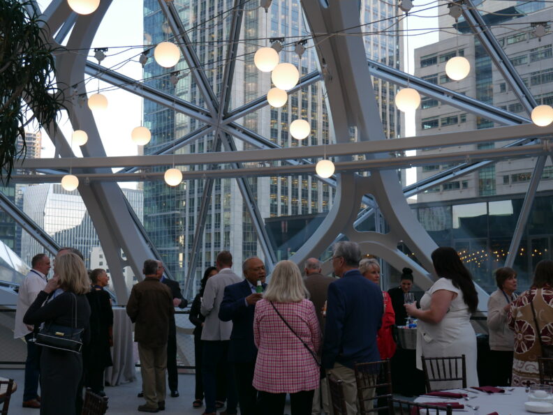 An image of a group of people inside the Amazon Spheres.