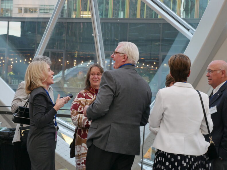 An image of two former Regents laughing.
