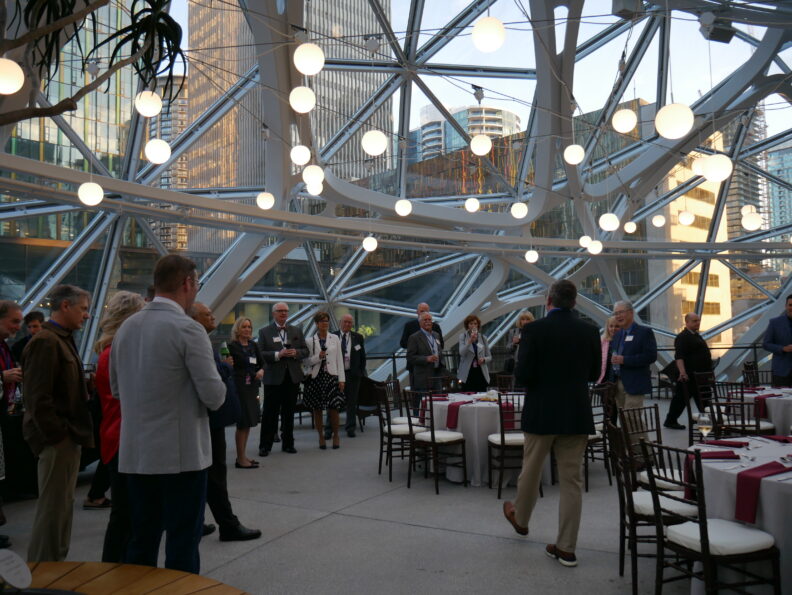An image of a group of people inside the Amazon Spheres.
