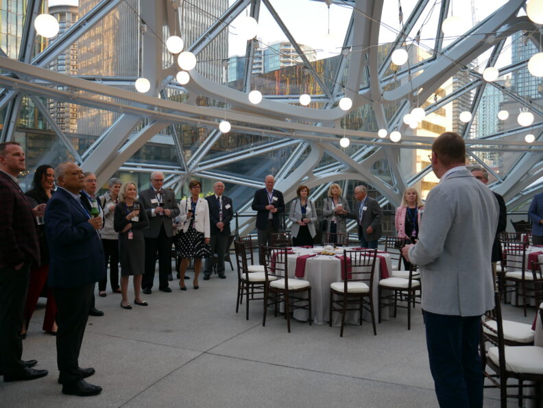 An image of a group of people inside the Amazon Spheres.