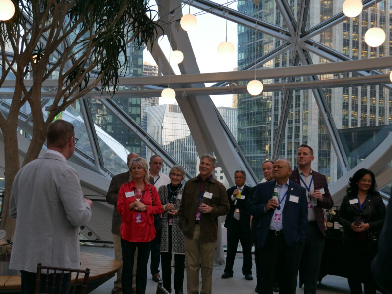 An image of a group of people inside the Amazon Spheres.