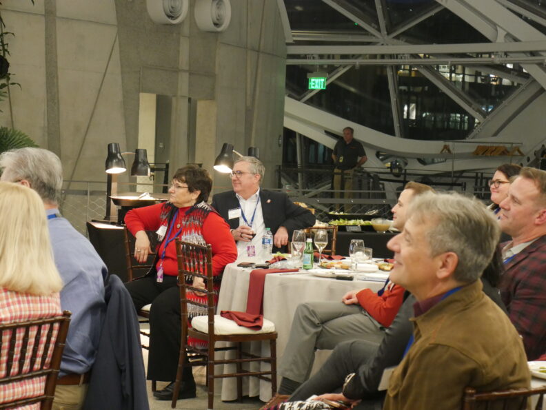 President Kirk Schulz and First Lady Noel Schulz listen to speech from former Regent.