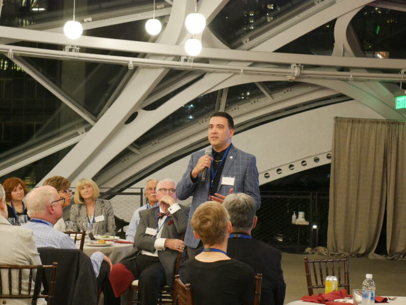 A former Regent gives speech to group inside the Amazon Spheres.