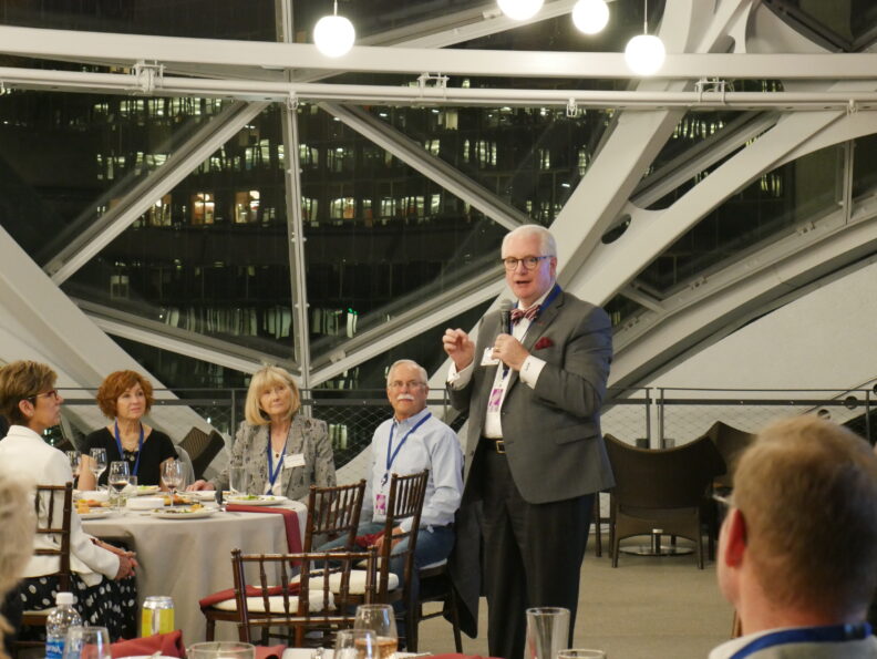 A former Regent gives speech to group inside the Amazon Spheres.