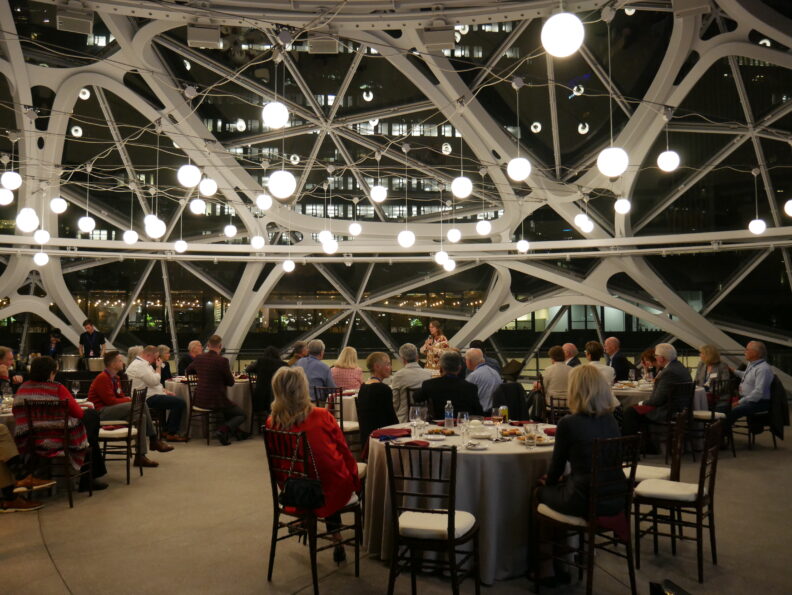 A Regent gives speech to group inside the Amazon Spheres.