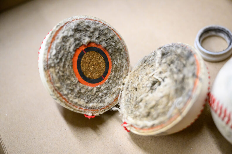 A baseball split into two halves.