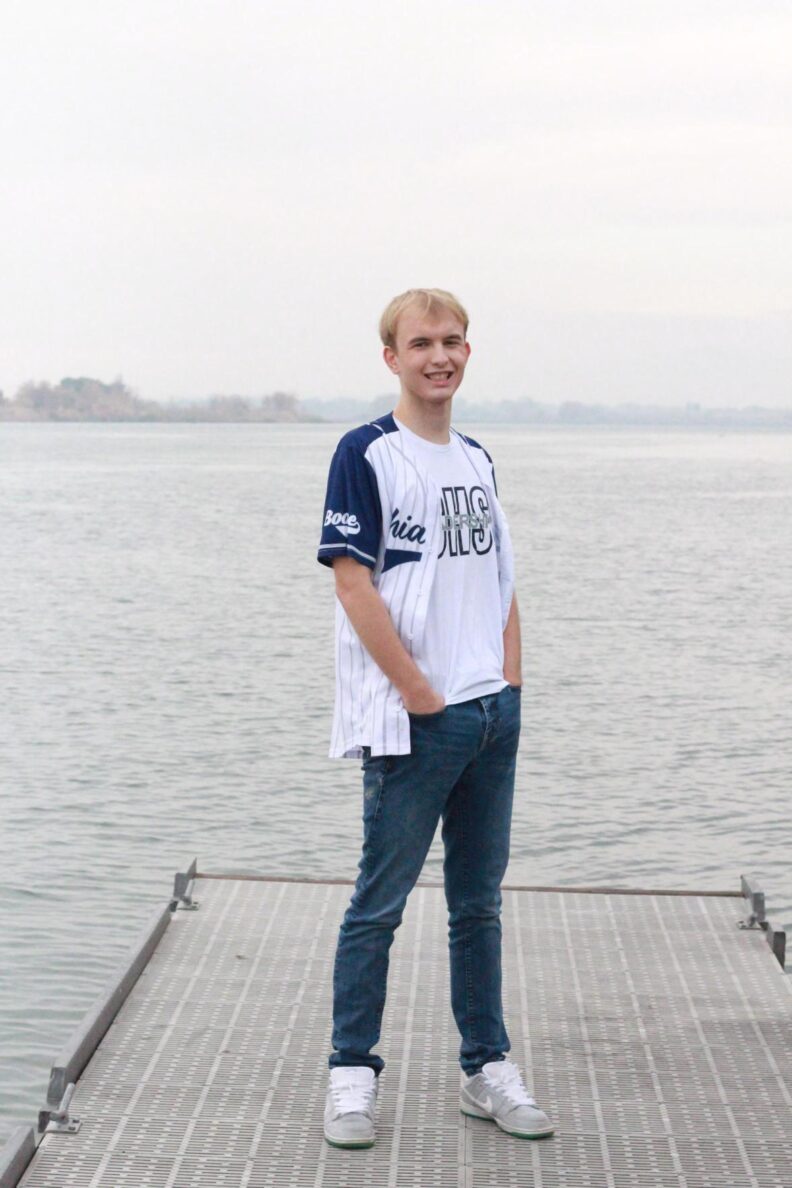 OL Boone is all smiles at the beach in a baseball jersey.
