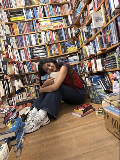 OL Evanshi sits in an alcove full of books
