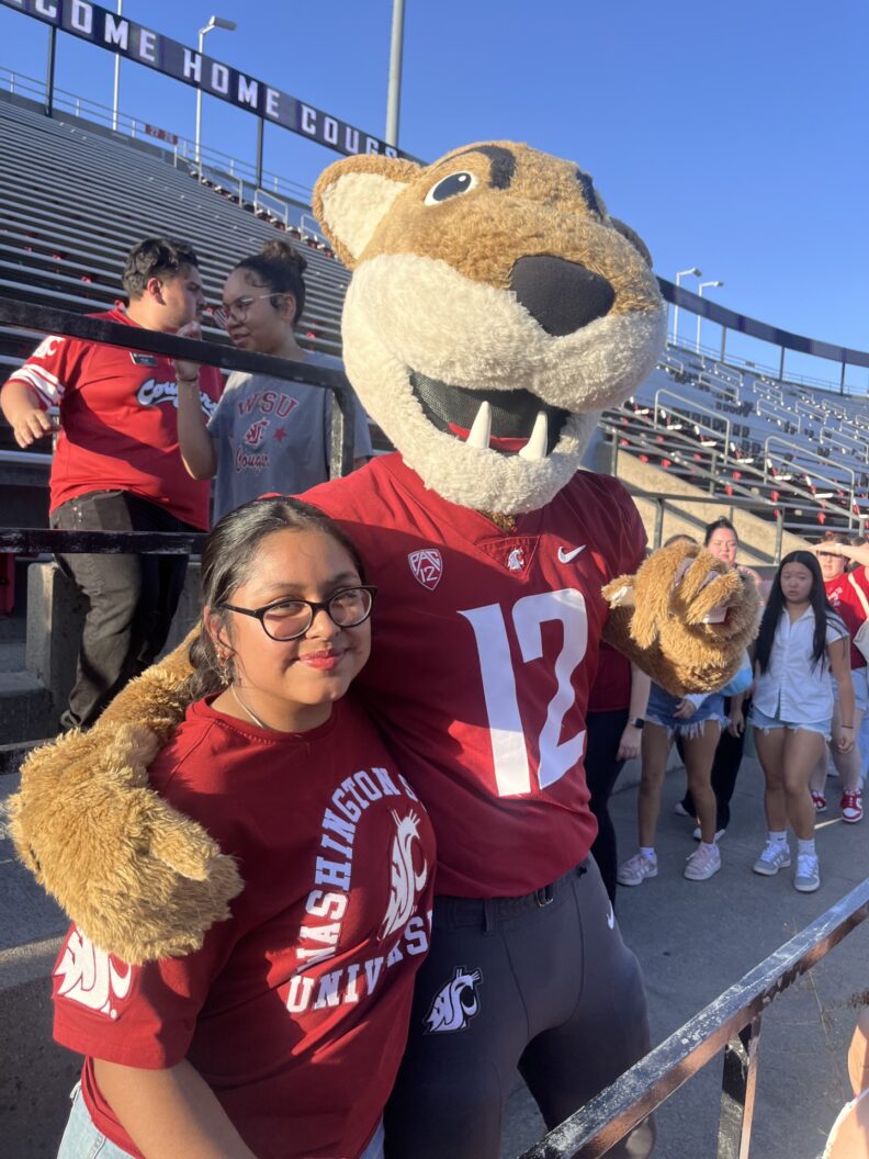 OL Nazareth smiles with Butch T. Cougar