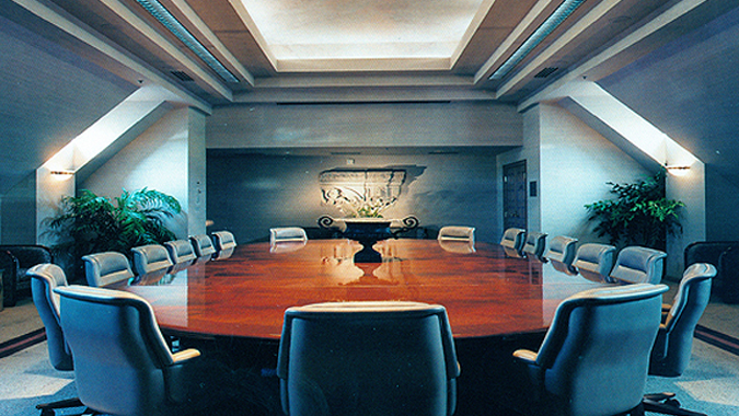 The formal boardroom has its own sound system, food service counter and built-in projection screens. An ideal location for formal meetings.