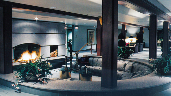 The elegant sunken fireplace area is ideal for casual conversation, small group discussions, and fireside receptions.