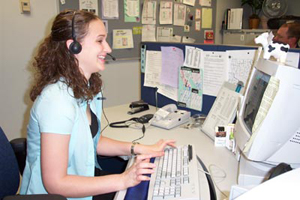 A photo of someone working at the Creamery phone center.