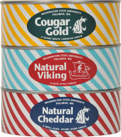 Three stacked cans of Cougar Cheese